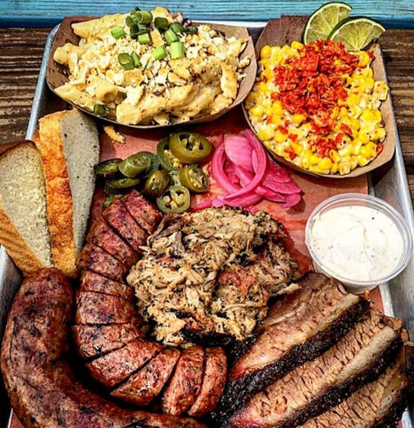 Texas-style bbq platter with brisket, sausage and sides